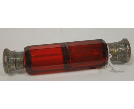 A late Victorian ruby faceted glass double ended scent bottle each end having engraved silver plated mount