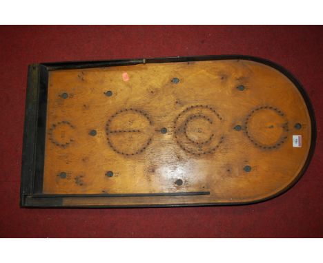 An early 20th century bagatelle board