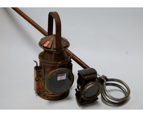 A mid-20th century brass cased railway lantern, bearing label for Wakefields, Birmingham, 1945; together with a Lucas 'King o