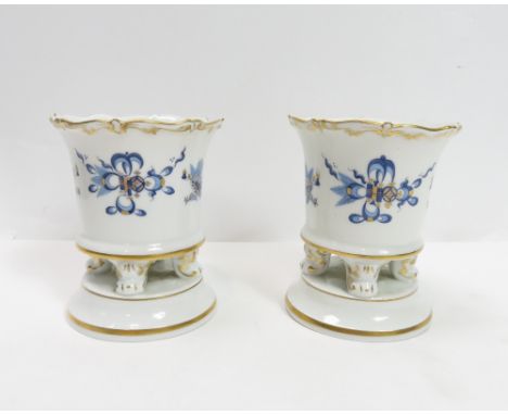A pair of 20th century Meissen ceramic vases, each decorated with two dragons on raised on a pedestal base, 8.8cm high