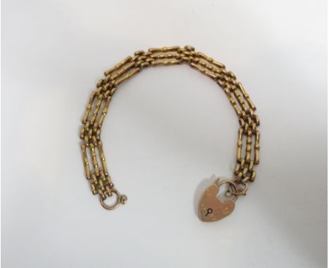 A bracelet, of three bar gate links, stamped '9ct', 18.5 cm long, 13 g gross