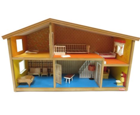 A vintage dolls house and various doll's house furniture