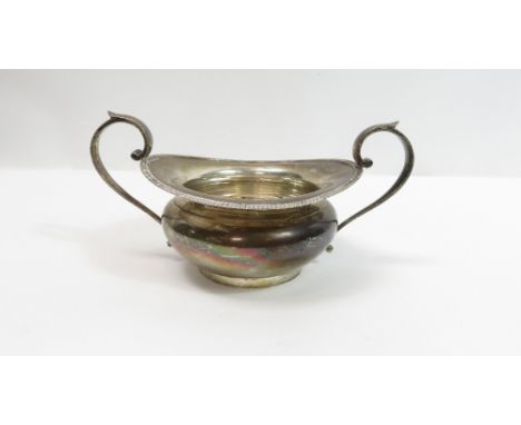 A large silver two handled sugar basin, by E Barnard and Sons Ltd, London 1921, the cape rim with gadrooned edge, 20 cm acros