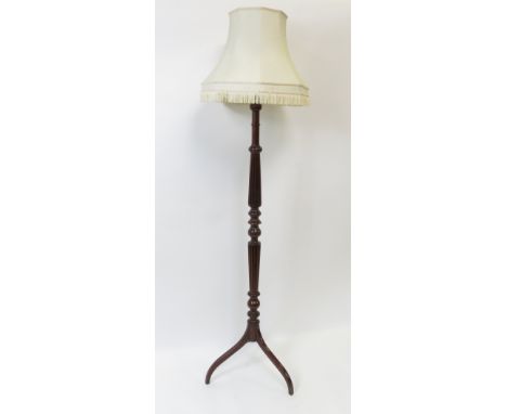 A 20th century mahogany standard lamp on tripod base