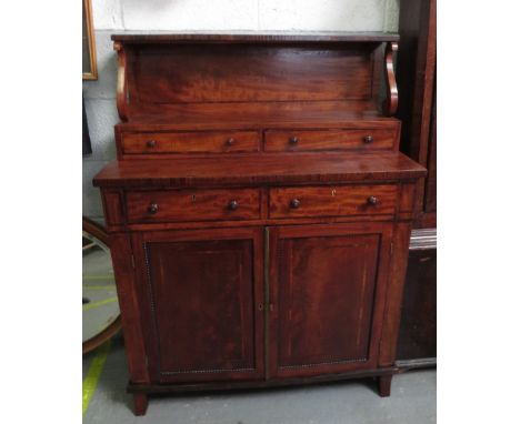 A Victorian mahogany chiffonier, with two drawers top shelf section and a two door shelf and cupboard section, with brass han