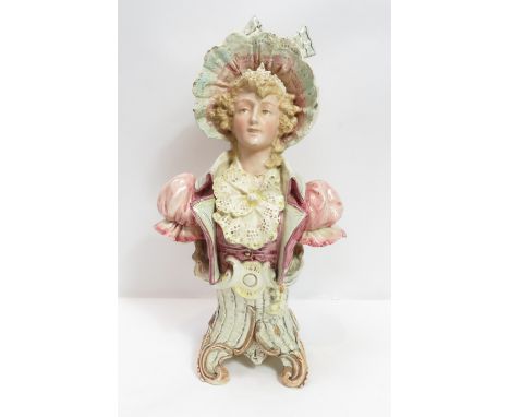 A Victorian ceramic bust of a female, on scrolled base, the base stamped “BU 1714”, 36cm high