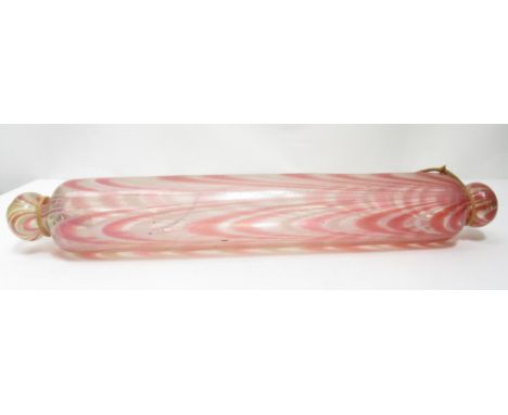 A Victorian Nailsea glass rolling pin, clear glass with pink and white detail, 43cms long