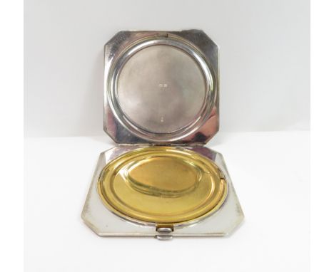 A silver powder compact, Birmingham 1937, of square cut corner outline, with engine turned decoration, 7.8 cm square