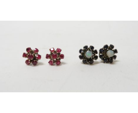 A pair of opal and sapphire cluster ear studs; with a pair of ruby cluster ear studs; both pairs unmarked; 4 g gross