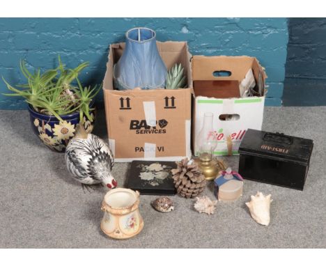 Two boxes of miscellaneous. Including planter with floral decoration, metal first aid box, wooden fruit and bowl, seashells, 