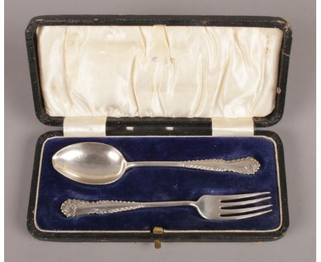 A cased silver baby's fork and spoon. Assayed for Birmingham, 1924, by Joseph Gloster Ltd. Total weight: 38.77g  