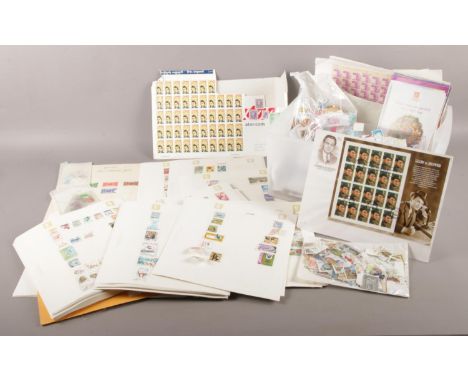 A box containing an extensive selection of UK and World stamps in mint and used states along with some 1st day issues. To inc