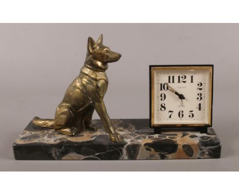 An Art deco bronze and marble marble clock set, signed Tedd.  