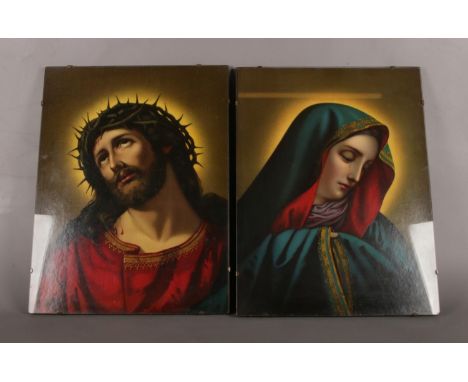 Two framed religious icon prints under glass. H:50cm, W:38cm.  