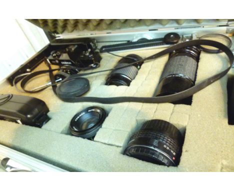 Boxed Cosina camera kit with four lenses