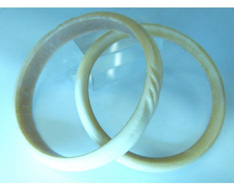 Two carved ivory bangles