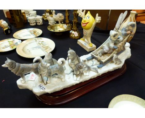 LLadro (Retired 1993) husky dogs with sledge on wooden base, sculpted by Salvador Delon    CONDITION REPORT:  The item appear