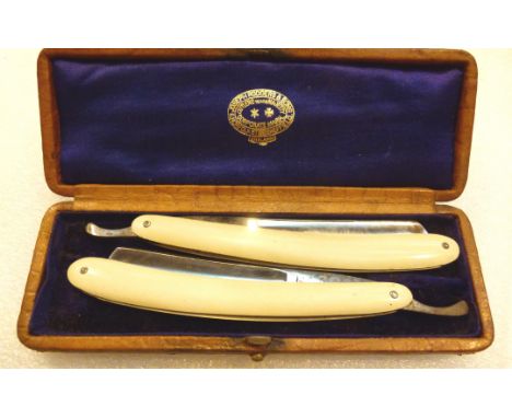 Pair of matched ivory cut throat razors 