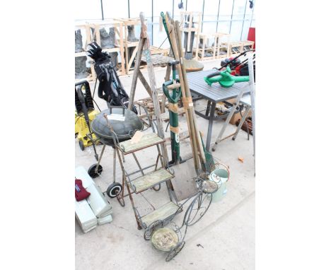 AN ASSORTMENT OF ITEMS TO INCLUDE A WOODEN STEP LADDER, A BBQ AND GARDEN TOOLS ETC