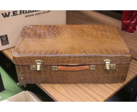 A LARGE CROCODILE SKIN BRIEFCASE