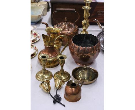 A QUANTITY OF BRASS AND COPPERWARE TO INCLUDE LARGE CANDLESTICKS, STOVE KETTLE, PLANTER, ETC.,