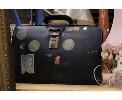 A VINTAGE LEATHER BRIEFCASE