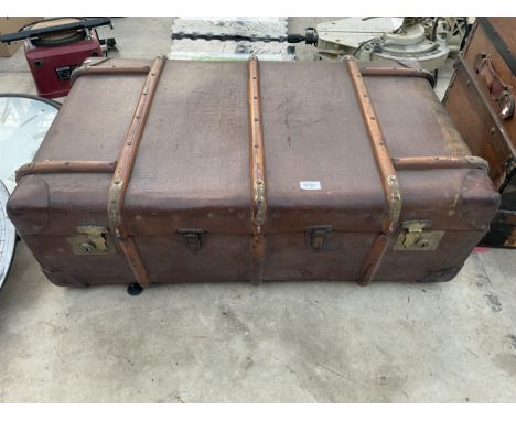 A VINTAGE WOODEN BANDED SUITCASE