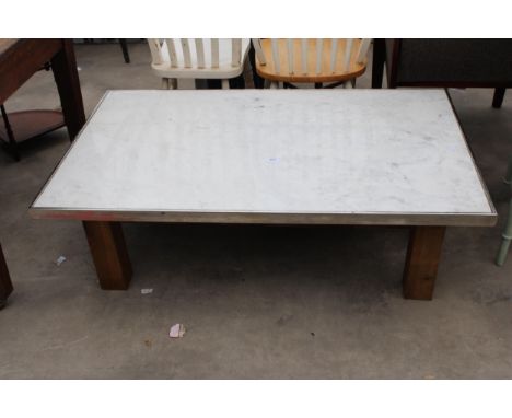 A MARBLE TOPPED COFFEE TABLE WITH POLISHED CHROME EDGE