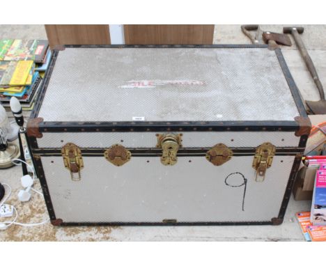 A METAL CASED TRAVEL TRUNK
