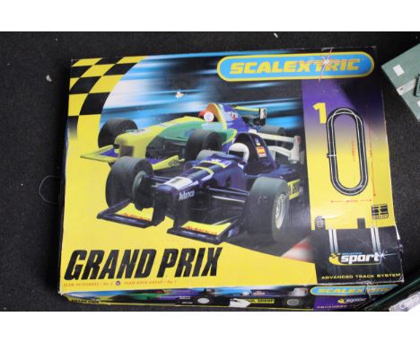 A SCALEXTRIC GRAND PRIX RACING SET - ONE CAR MISSING