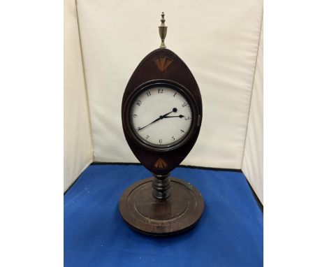 AN INLAID MAHOGANY MANTLE CLOCK WITH WHITE ENAMEL DIAL AND BRASS FINIAL