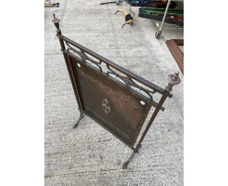 A DECORATIVE COPPER FIRE SCREEN