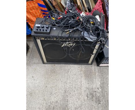 A LARGE PEAVEY AMPLIFIER, A MIC STAND, MICROPHONE AND CABLES ETC