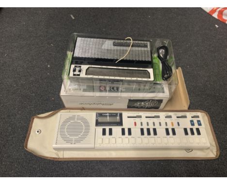 A BOXED STYLOPHONE AND A CASIO ELECTRONIC MUSICAL INSTRUMENT