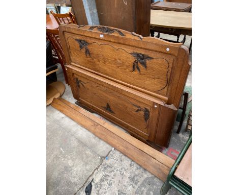 AN OAK CONTINENTAL CARVED 5' BEDSTEAD