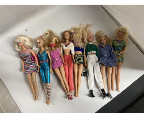 EIGHT DRESSED BARBIE DOLLS