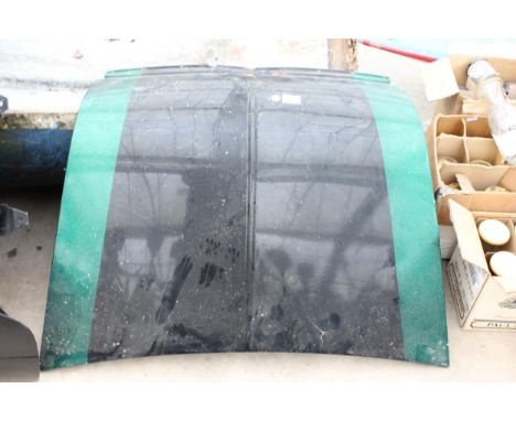 A SMALL VINTAGE CAR BONNET