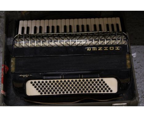 A VINTAGE HOHNER ATLANTIC PIANO ACCORDIAN IN A CASE