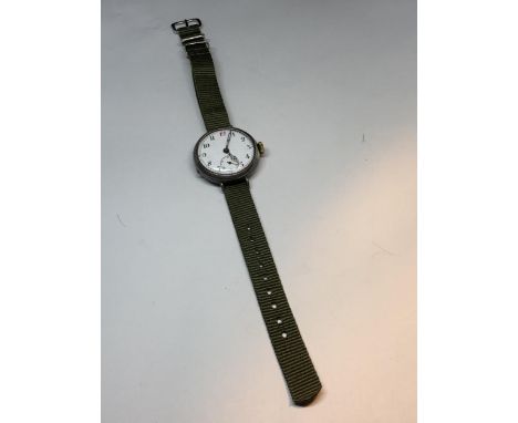 A MARKED 925 SILVER WATCH WITH WHITE ENAMEL FACE AND SUB DIAL. GREEN CANVAS STRAP SEEN WORKING BUT NO WARRANTY