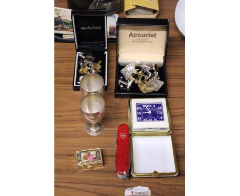 AN ASSORTMENT OF ITEMS TO INCLUDE A SMALL TRINKET BOX, CUFF LINKS, GOBLETS, A SWISS ARMY KNIFE AND A TRAVELLING ALARM CLOCK