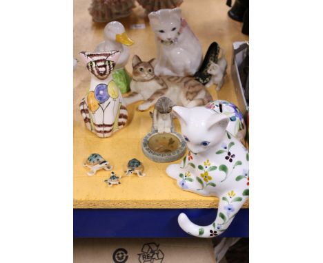 A QUANTITY OF ANIMAL FIGURES TO INCLUDE CERAMIC TURTLES, CATS, DUCK, ETC.,