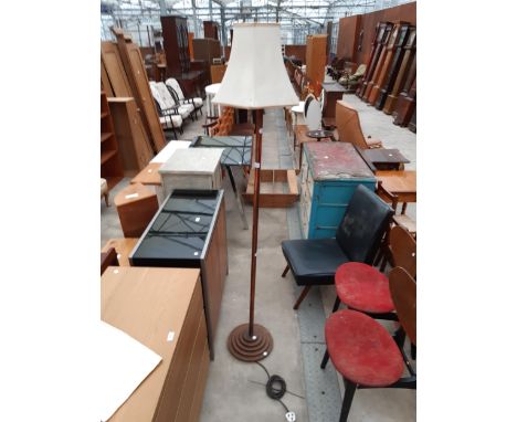 A MID 20TH CENTURY COPPER STANDARD LAMP AND SHADE ON STEPPED BASE