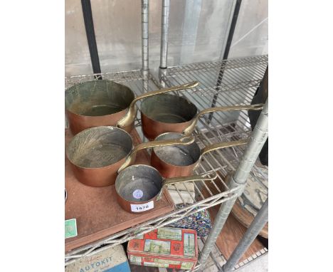 A SET OF FIVE VINTAGE COPPER PANS WITH BRASS HANDLES