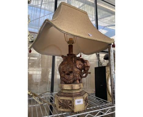 A DECORATIVE TABLE LAMP WITH SHADE AND TREEN ELEPHANT BASE