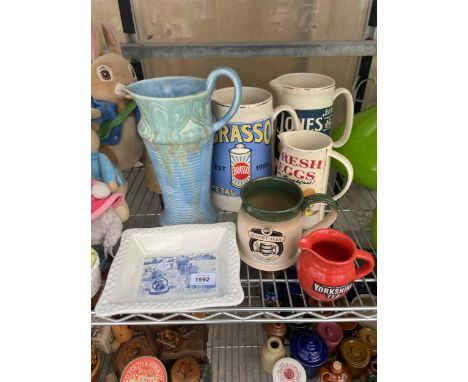 AN ASSORTMENT OF VARIOUS CERAMIC JUGS TO INCLUDE BRASSO AND YORKSHIRE TEA AND A BLUE AND WHITE SHREDDED WHEAT DISH ETC