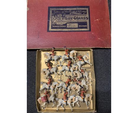 A VINTAGE SET OF TWELVE BRITAINS, MOUNTED BAND OF THE FIRST LIFEGUARDS, WITH RED JACKETS