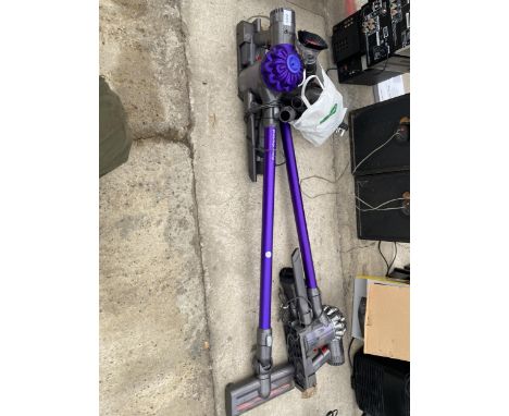 TWO DYSON STICK VACUUM CLEANERS WITH CHARGER AND ACCESSORIES