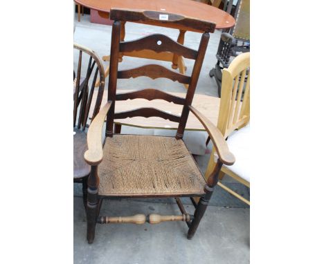 AN 18TH CENTURY ELM LADDER BACK ELBOW CHAIR WITH RUSH SEATS