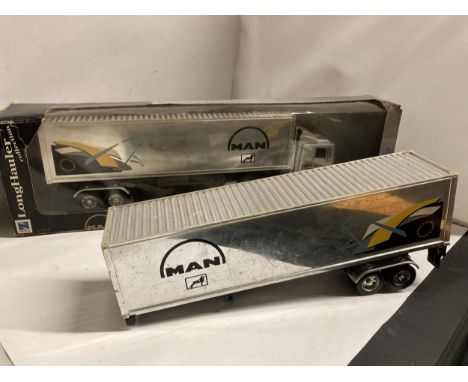 A BOXED NEW-RAY LONG HAULER COLLECTION MAN 19.603 FLS TRUCK, 1/32 SCALE, PLUS AN UNBOXED ONE