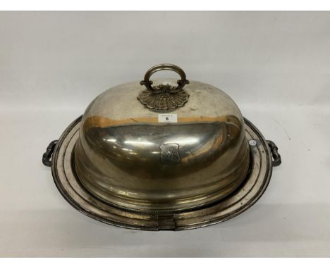 A LARGE VINTAGE SILVER PLATED MEAT SERVING PLATTER, FOOTED WITH MONOGRAMED DOME